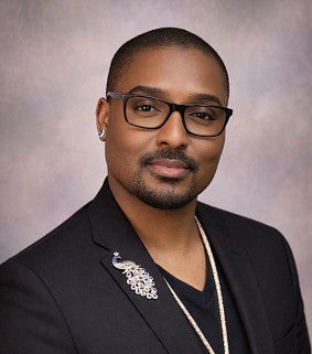 Headshot of Sedret Whitfield. An African American man.