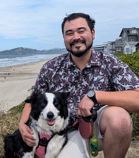 Abe Smith at the Oregon Coast with his dog